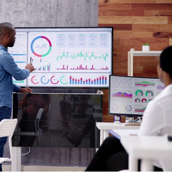 Corporate Training Presentation In Classroom With Computers